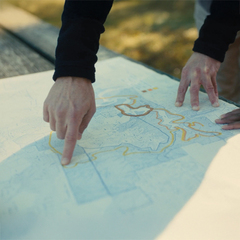 a person pointing at a map