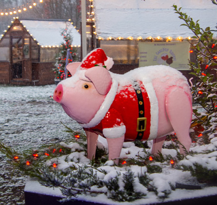 a pig statue in the snow