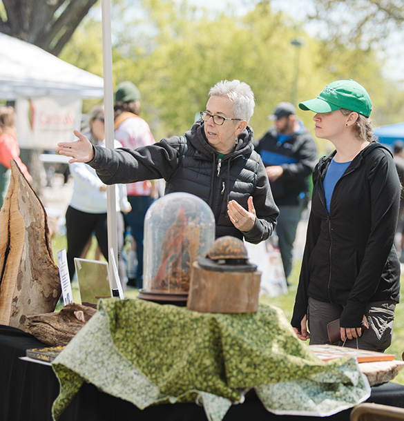 Guests at a booth at the protect your wild event