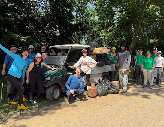 a group of people standing next to a truck
