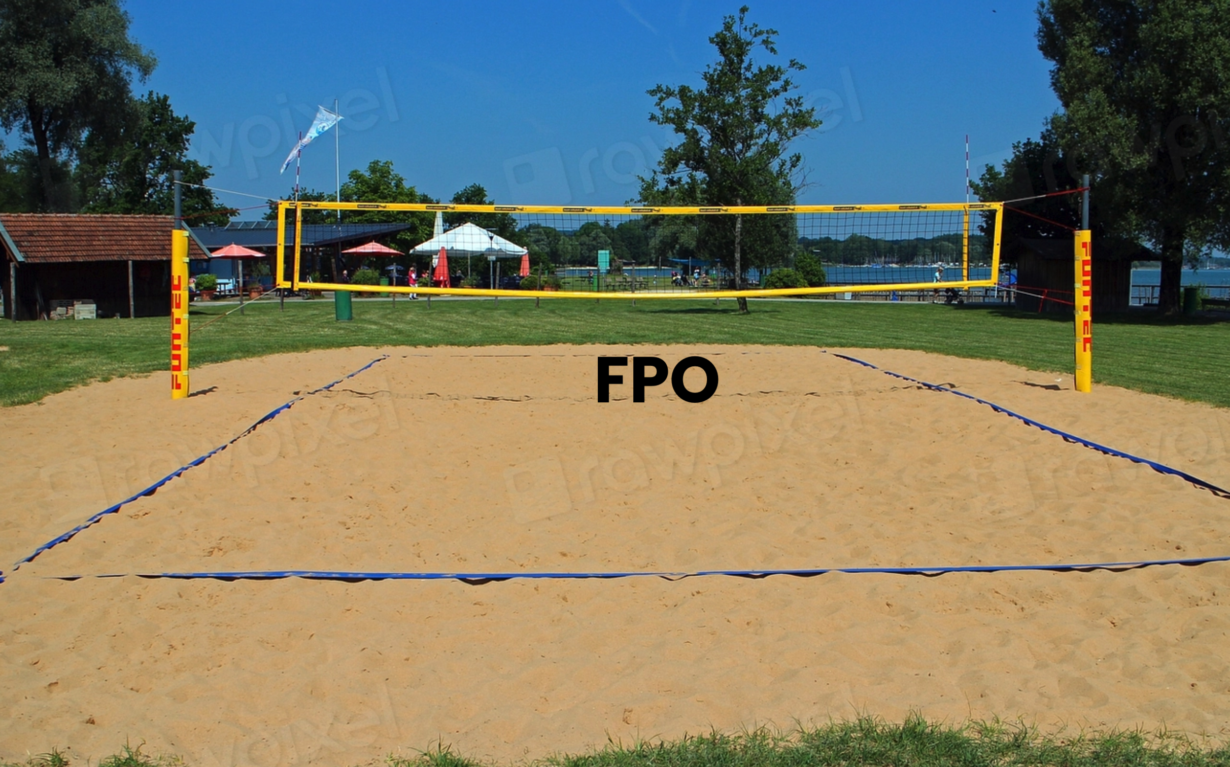 a sand volleyball court in a park