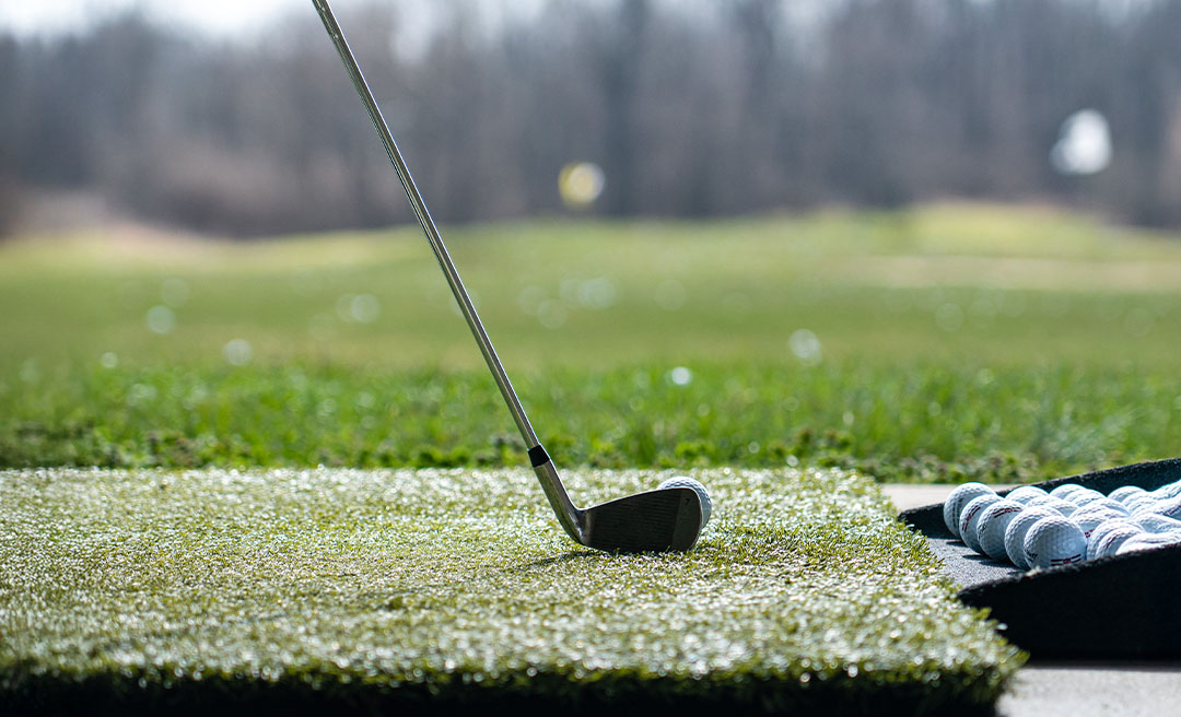 a golf club on a green field
