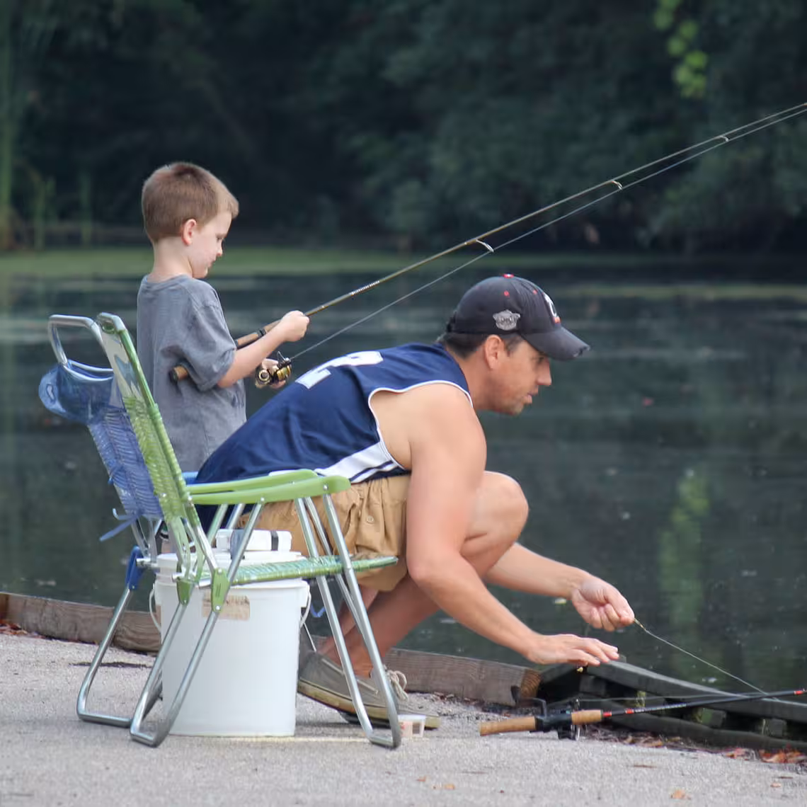 Father and son fishing together