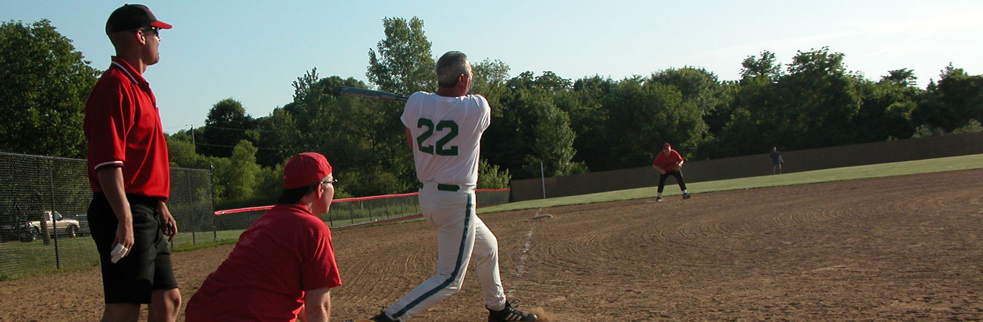 man swinging at a softball