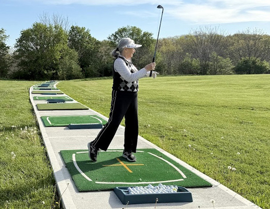 a group of women playing golf