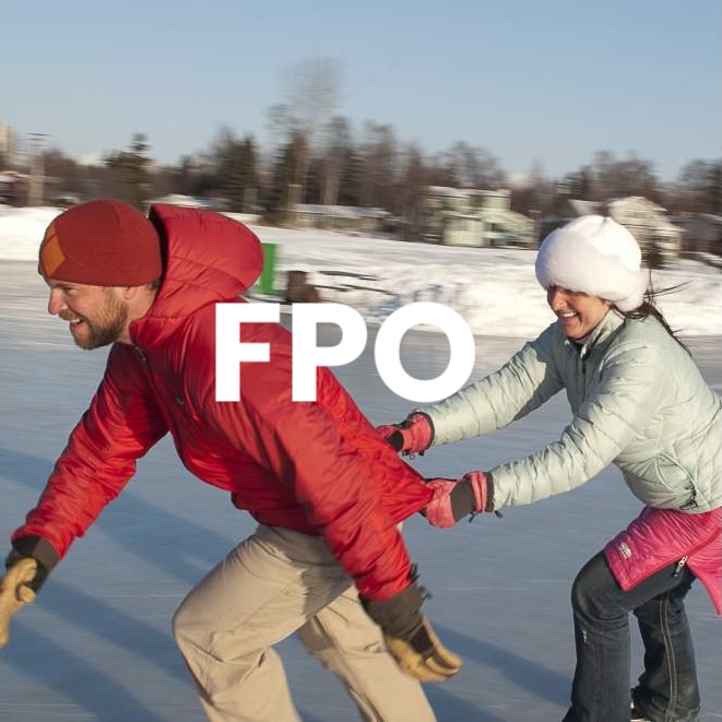 Couple ice skating outdoors
